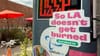 My "So LA doesn't get burned sticker" for Torched.la on a post with other stickers at Spoke Bicycle Cafe