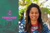 The Torched Talks logo with a photo of Karen Mack wearing a blue batik dress and red beaded necklace