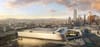 A rendering of LA's new convention center expansion, a huge silver shiny building at the edge of downtown