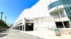 LA's convention center, a wall of white stone and blue glass brick that's looking a bit worse for the wear