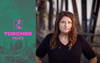 The Torched Talks logo in front of an LA skyline with Jessica Henson standing on a bridge in a black shirt