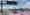 A rendering of a freeway with two lanes in purple paint that read LA28, the signboard also says LA28 vehicles only