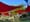 A colorful shade canopy over a grassy Grand Park lawn helps to shade areas not covered by trees