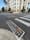 An intersection in LA's Koreatown shows newly painted crosswalks, one of which En Memoria de Nadir Gavarrete with fruits painted around it